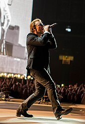 U2 frontman Bono at the Joshua Tree Tour 2017, their sixth annual most-attended tour since 1997 U2 performing in Amsterdam 07-29-17 (35459354254).jpg