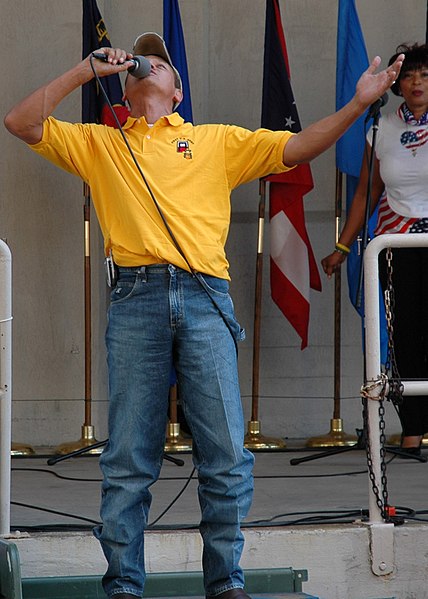 File:US Navy 050921-N-9274T-015 Three-time platinum album country music singer Neal McCoy performs at a USO concert for military personnel supporting Hurricane Katrina relief efforts.jpg