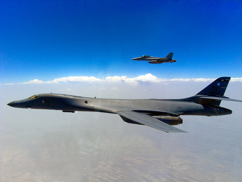 File:US Navy 090625-N-2971J-001 An F-A-18F Super Hornet from the Jolly Rogers of Strike Fighter Squadron (VFA) 103, embarked aboard the aircraft carrier USS Dwight D. Eisenhower (CVN 69), flies alongside a U.S. Air Force B-1B Lancer.jpg