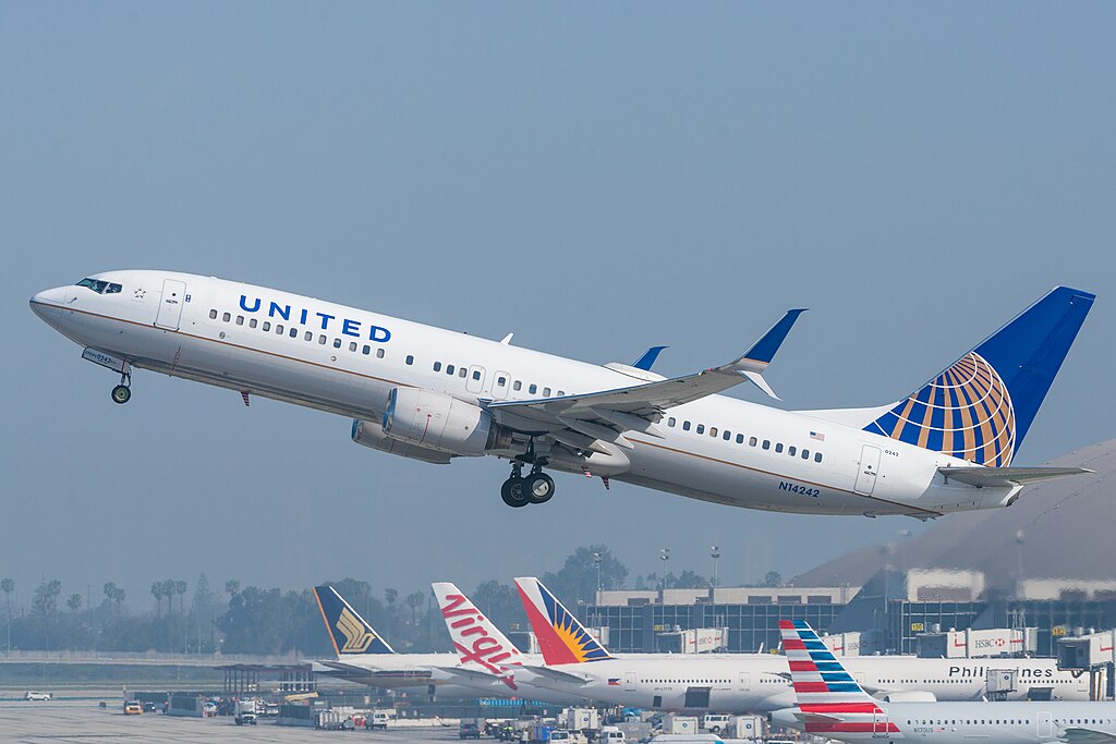 United Airlines Boeing 737-800 taking off the runway.