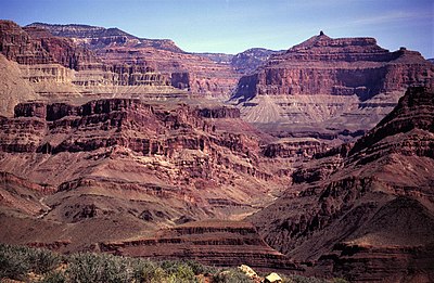 View northeast toward Shinumo Creek canyon and toward tilted strata of Neoproterozoic Bass Formation “island” of northeast-dipping Mesoproterozoic strata. Holy Grail Temple in upper right.