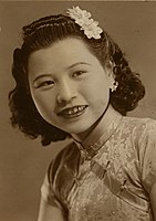 Woman with golden teeth in Qipao.jpg