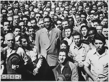 Robeson leading Moore Shipyard (Oakland, California) workers in singing the Star Spangled Banner, September 1942.