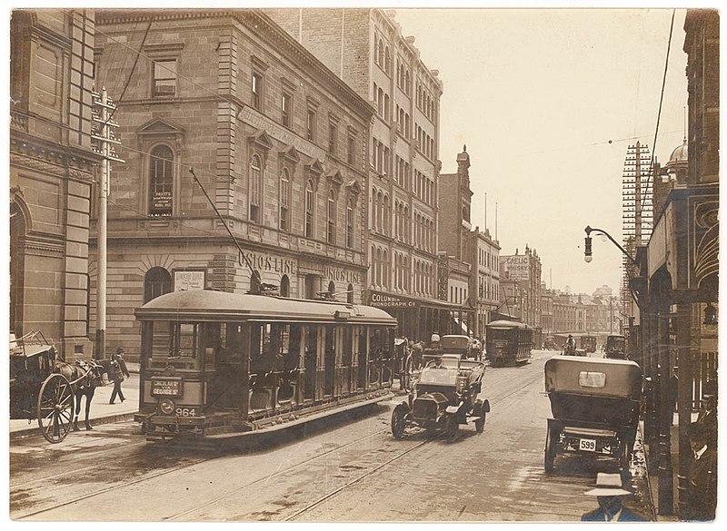 File:(Looking north along George Street (with tram, T-model Ford and hansom cab) from Union Line Building (incorporating the Bjelke-Petersen School of Physical culture), corner Jamieson Street), n.d. by (5955844045).jpg