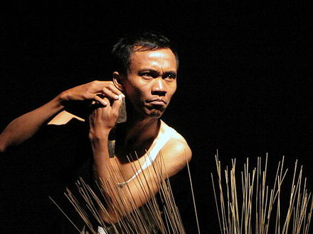 Indonesian contemporary dance involved in a play performance.