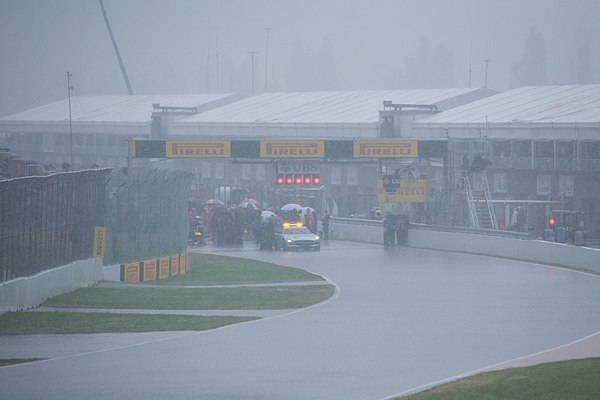 Heavy rain hit the circuit forty minutes into the race. Initially the FIA tried to keep the race going behind the safety car, but the track conditions