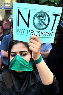 A reformist protester holding a placard who wrote: Ahmadinejad is not my president. 6th Day - Not My President.jpg
