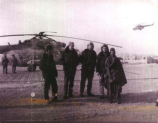 Above: Mujahideen fighters in Kunar Province, 1987 Below: Soviet airmen with a local Afghan man in Logar Province, 1987