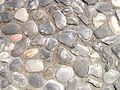 Cobblestones at a central place in the city of Imola in Italy