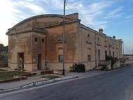 The now derelict Australia Hall at St Andrew's Barracks, built as a theatre and cinema after World War I. Australia Hall, Pembroke.jpeg