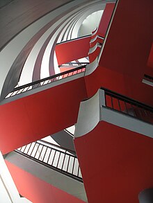 Berthold Lubetkin's staircase in Bevin Court, London, after repainting circa 2014 Bevin Court staircase now red.jpg