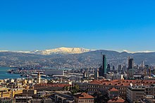 View of the Saint George Bay, and snow-capped Mount Sannine from a tower in the Beirut Central District Bey-Sannine-BCD.jpg