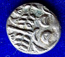 Silver Stater, stylised head of Apollo, about 60 BC, obverse Britain Celtic Silver Stater, Belgic Migration Durotriges, about 60 BC, obverse.jpg