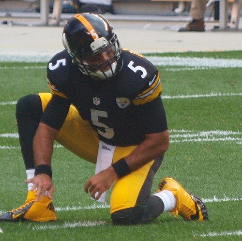 Pittsburgh Steelers backup quarterback Bruce Gradkowski acting as the ball holder for a kick