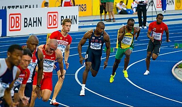 Sprinters during a 200 m race Crawford, Dzingai 200 m Berlin 2009.jpg