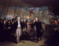 On the deck of a sailing warship, with men in blue and red military uniforms standing in a line, a man in a long blue coat passes a sword to a large man in a short, open blue coat, who holds his hands wide with their palms flat. In the background several ships in various states of disrepair drift between columns of smoke with the sun low on the horizon.