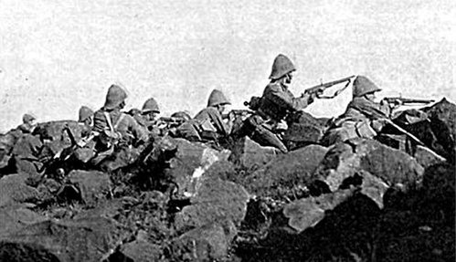 Soldiers of the Devonshire Regiment at the Relief of Ladysmith, 1900. They are facing Pepworth Hill, firing from behind boulders which provided for an