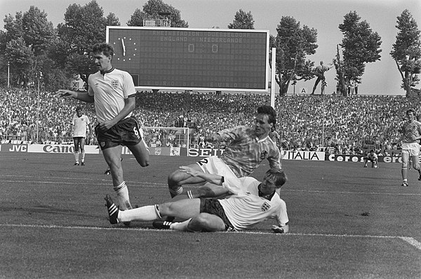 Stevens (centre) playing for England at UEFA Euro 1988, as the Netherlands' Marco van Basten scores the first of his three goals