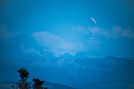 Eclipsed moon rises over the Alps (41890912450)