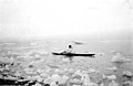 Eskimo man paddling kayak among chunks of ice close to shore, Seward Peninsula, Alaska, between 1908 and 1915 (AL+CA 6401).jpg