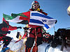 Dudu Yifrah with the sewn together Israeli-Palestinian flags on the summit of Everes