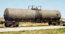 An older DOT-111 tank car manufactured in 1967 shown as it appeared in 1996. This car was equipped with an insulating jacket and had a capacity of 20,670 US gallons (78,200 L; 17,210 imp gal). FRA NATX22746 DOT-111 tank car.png