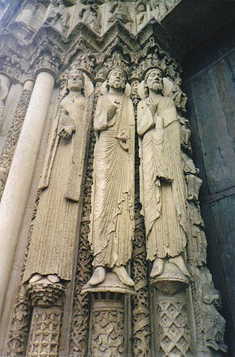 The Western (Royal) Portal at Chartres Cathedral (ca. 1145). These architectural statues are among the earliest Gothic sculptures and were a revolution in style and the model for a generation of sculptors. Figures from Cathedral of Chartres.jpg