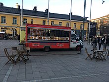 A food truck at Kamppi Plaza in Helsinki, Finland Food truck in Kamppi plaza (42738065185).jpg