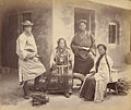 Four Bhutanese in front of a house in Darjeeling (c. 1860s).jpg