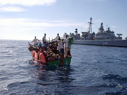Frigate Karlsruhe of the German Navy rescuing shipwrecked people off the coast of Somalia where it is patrolling