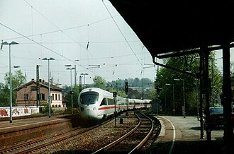 An Intercity-Express train passes through the station. The only services that stop here are shorter-distance regional services. The old station building is on the left. ICE Saarbr. - Dresden in St. Ingbert.jpg