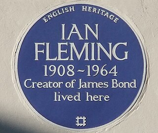 Blue plaque marker commemorating a link between a location and a person or event