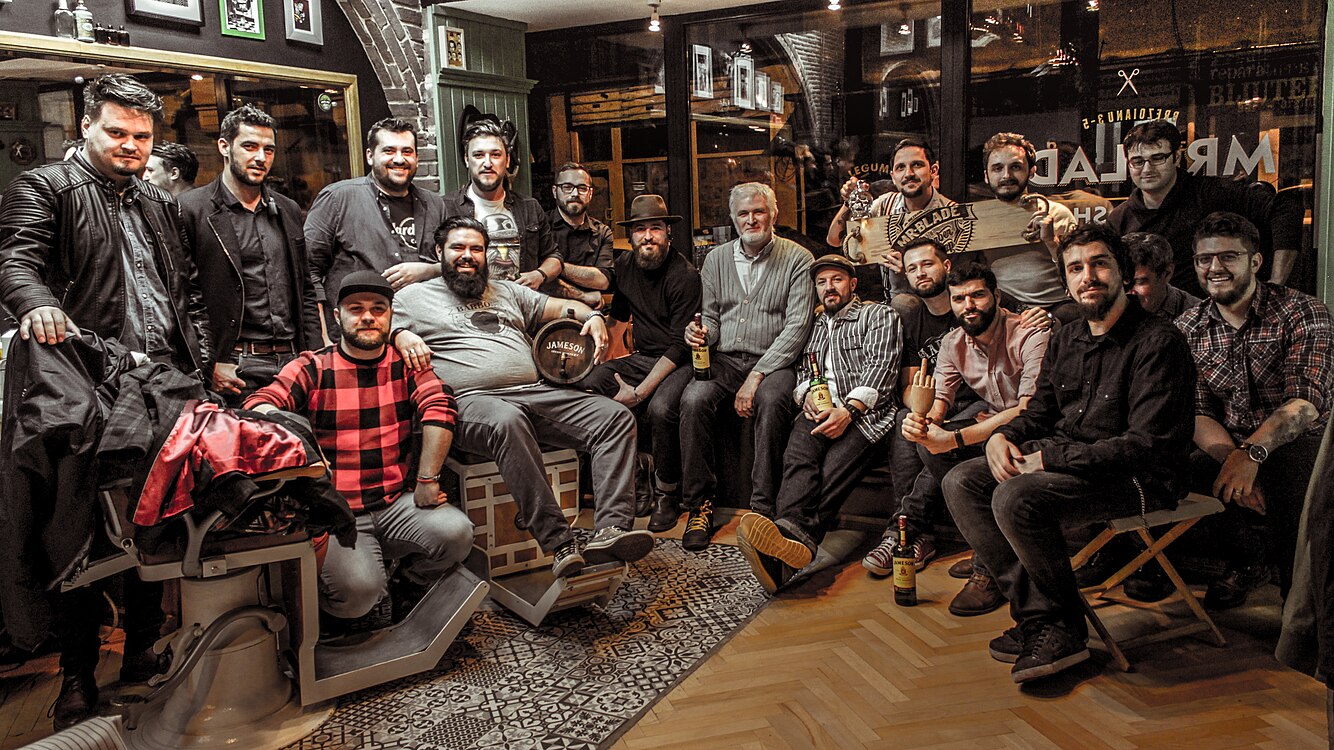 Barbershop in Bucharest around 2016. Men find the lost comradery between their peers, inside such "new traditional" barbershops, a revival of the old ones.