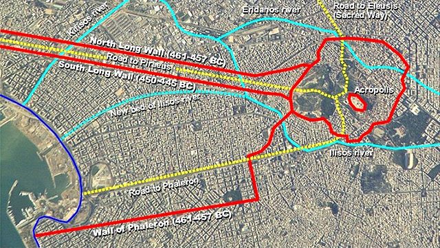 The fifth century BC fortification of Athens (red lines) superimposed on a recent astronaut photo. Also shown the river beds in ancient times (cyan li