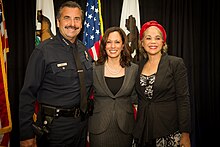 From left to right: LAPD chief Charlie Beck, Harris, and civil rights lawyer Constance L. Rice celebrate the 50th anniversary of the signing of the Civil Rights Act of 1964. Kamala Harris Delivers Remarks on 50th Anniversary of the Signing of the Civil Rights Act 03.jpg