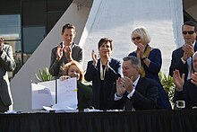 Mayor Jenny Durkan and others celebrating after she signed legislation authorizing the arena renovation