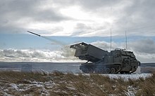 MLRS captured as a training round leaves the launch tube on the ranges at Otterburn. MOD 45158570.jpg