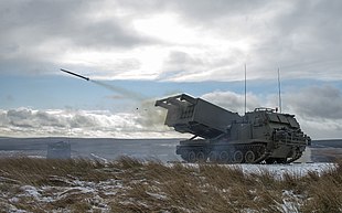 MLRS firing a live missile at Otterburn Training Area MLRS captured as a training round leaves the launch tube on the ranges at Otterburn. MOD 45158570.jpg