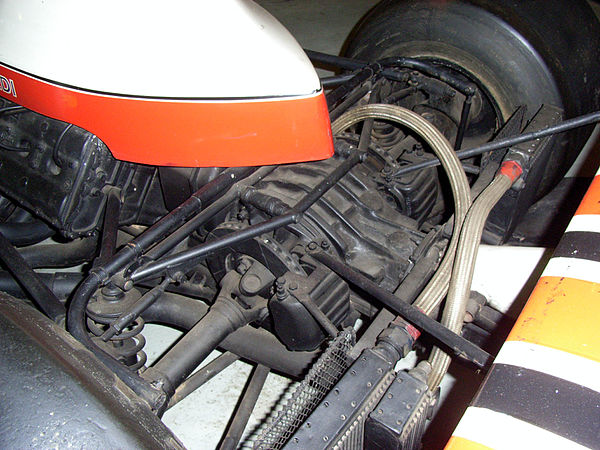 The McLaren M23's rear brakes nestle between the universal joints and the transaxle