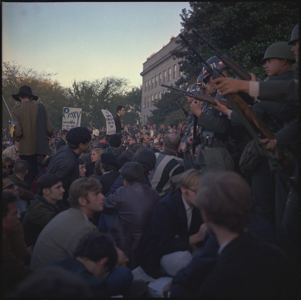 File:Members of the military police keep back protesters during their sit-in at the Mall Entrance to the Pentagon. - NARA - 530618.tif