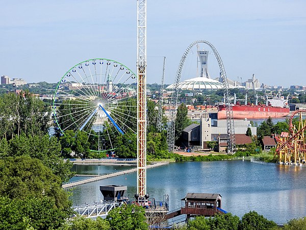 Several amusement rides around Dolphin Lake, a body of water at La Ronde