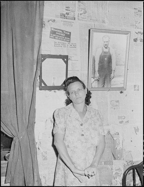 File:Mrs. Leanore Miller, widow of a miner, with a picture of her husband. She said, "there's more widows and orphens in... - NARA - 541245.jpg