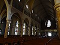 The nave of Saint Patrick Church, viewed from the the edge of the south end of the transcept. Located at 284 Suffolk Street, Lowell, Massachusetts.