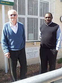 David Pinkess (Fred Pinkess' son), near the foundation stone of the church Outside church with David Pinkess.jpg