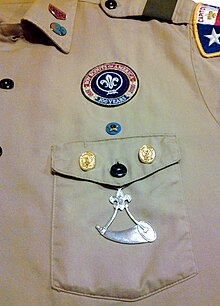 World Crest with the 1910 Anniversary Ring in 2013 Powder Horn (Boy Scouts of America) Hanging Medal On Boy Scout Class A Field Uniform.jpg