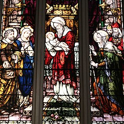 Stained glass window at St. Michael's Cathedral (Toronto) depicts Infant Jesus at the Temple