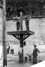 Prisoners at a whipping post in a Delaware prison, c. 1907 Prisoners whipped.jpg