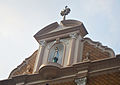 The pediment of the Santa Cruz Church located on the topmost portion of the entrance.