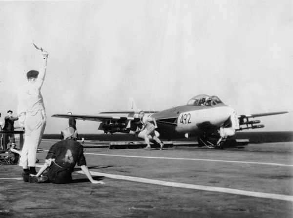 A Hawker Sea Hawk of 899 Naval Air Squadron, armed with rockets, about to be launched from the aircraft carrier HMS Eagle for a strike on an Egyptian 