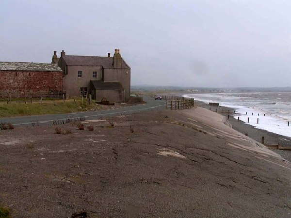 At Dubmill Point on the parish's western boundary, the B5300 coast road runs atop the concrete sea wall.